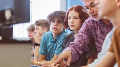 group of high school students learing programming