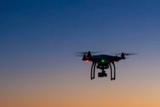 drone flying over ocean at dawn