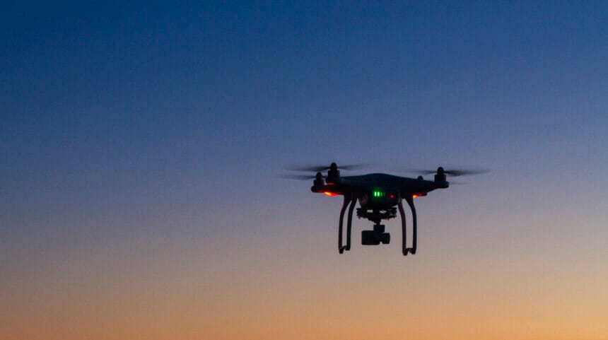 drone flying over ocean at dawn