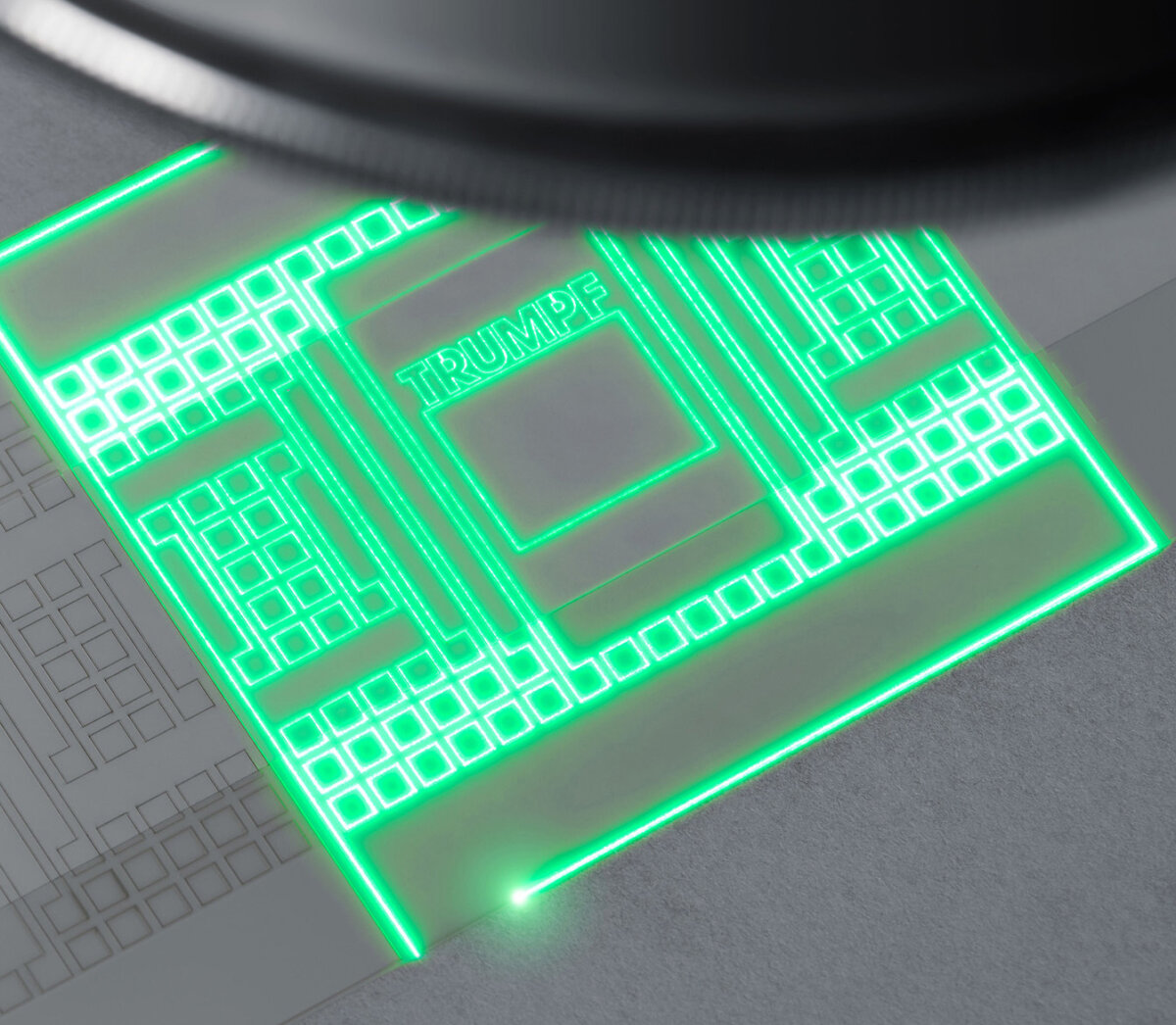 Grün leuchtende Laserstruktur mit TRUMPF-Schriftzug